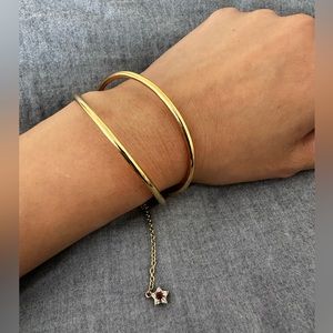 Elizabeth and James Nova Cuff with dangle star in Yellow Gold plated gold tone